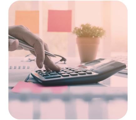 Calculator, post it notes and plant